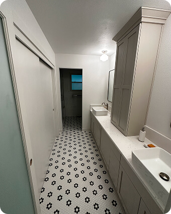 Construction workers reviewing blueprints at a building site with cranes and scaffolding.